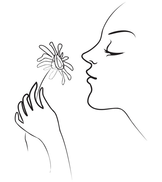 Girl holds in her hand tenderly daisy