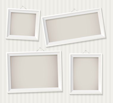 White empty frame hanging on the wall clipart