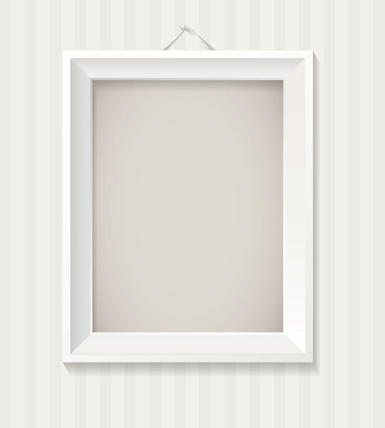 White empty frame hanging on the wall