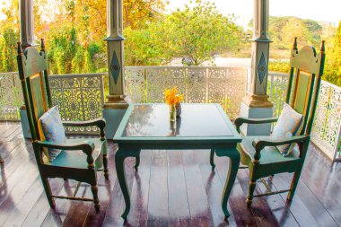 Table and chairs in front of the restaurant;