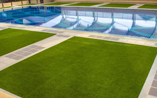 Green Artificial Turf Pool Fotos de stock libres de derechos