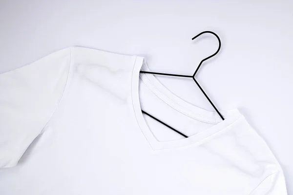 White shirt in a hanger, premium image by rawpixel.com / Felix