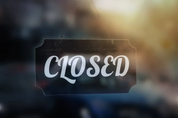 The sign closed on the door of a street cafe, behind glass — Stock Photo, Image