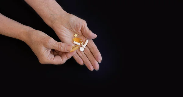 Close Hands Elderly Woman Chooses Pill Pressure Black Background Copy — Stock Photo, Image