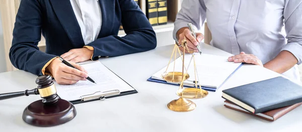 Female lawyer or Counselor working in courtroom have meeting with client are consultation with contract papers of real estate, Law and Legal services concept.