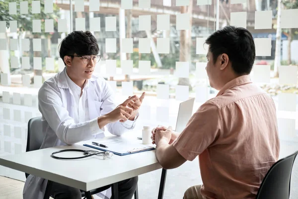 Male Doctor Discussing Patient Explaining Symptoms Disease Diagnosis Checking While — Stock Photo, Image