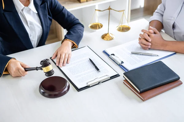 Businesswoman and female lawyer or judge consult and conference having team meeting with client at law firm in office, Law and Legal services concept.