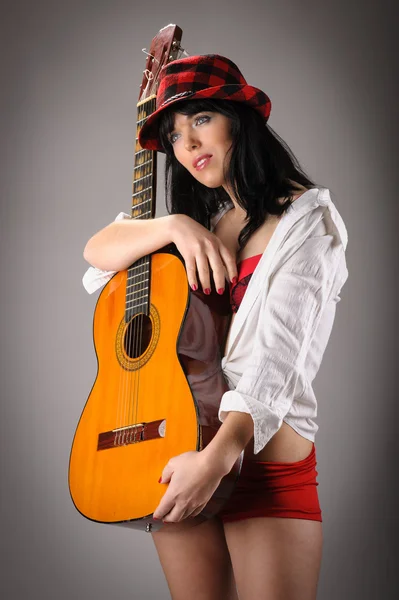 Woman holding classic guitar — Stock Photo, Image