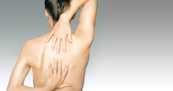 Woman Touching Her Back Because Hurts View Back Isolated Gradient — стоковое фото