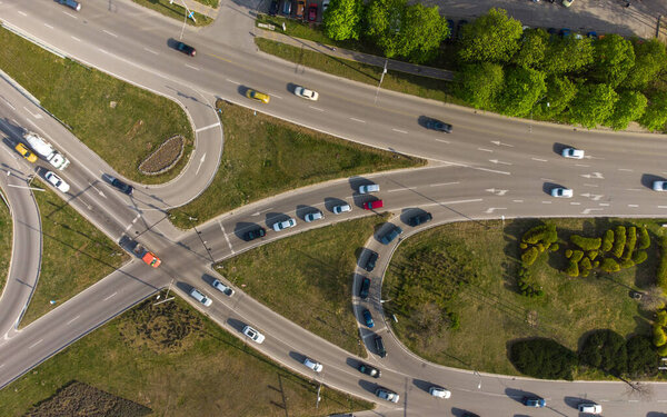 Aerial top view from a drone to a road junction in the city