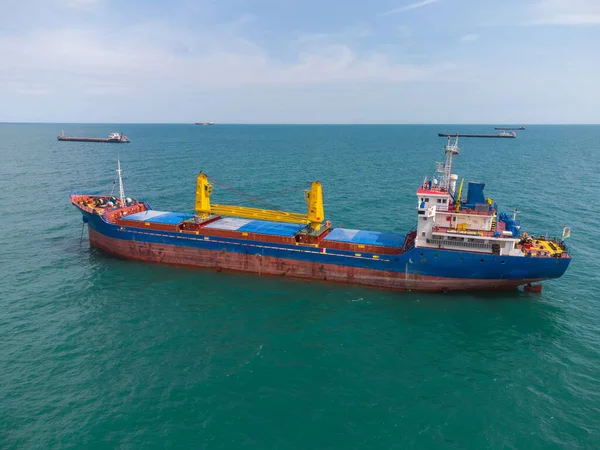 Large general cargo ship tanker bulk carrier, aerial top view.