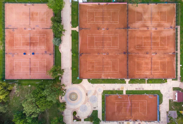 Aerial top view of tennis courts. Public sporting area outdoors from above.