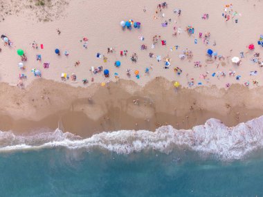 Aerial top View From Flying Drone Of People Crowd Relaxing On Beach In Bulgaria