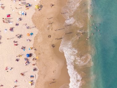 Aerial top View From Flying Drone Of People Crowd Relaxing On Beach In Bulgaria