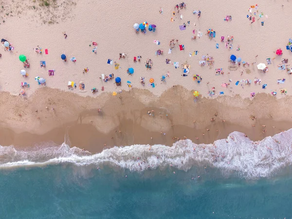 Aerial top View From Flying Drone Of People Crowd Relaxing On Beach In Bulgaria