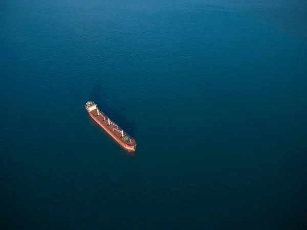 Large general cargo ship tanker bulk carrier, aerial top view.