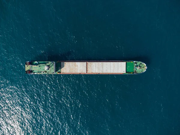 Aerial drone top down view of the cargo ship bulk carrier