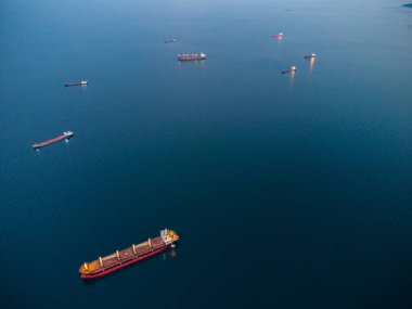 Large general cargo ship tanker bulk carrier, aerial top view at night.
