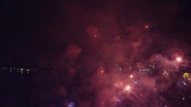 fireworks over the night city aerial view