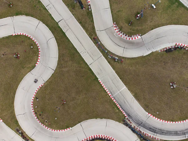 aerial top view of the karting track during the race. Several racing karts compete on a special track.