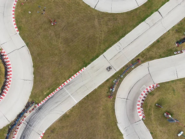 aerial top view of the karting track during the race. Several racing karts compete on a special track.