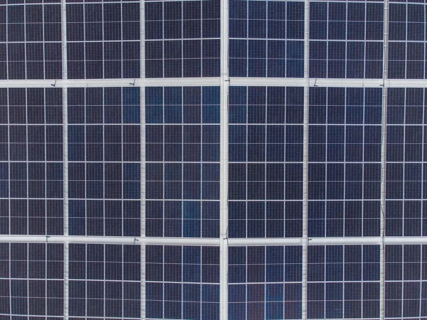 Solar panels on a house roof, aerial top down view