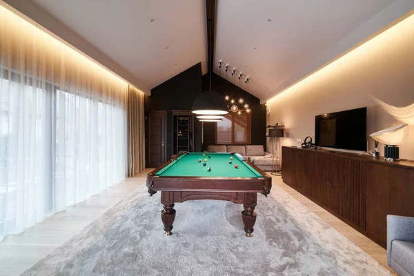 modern billiard room with a beautiful table and large windows, nobody