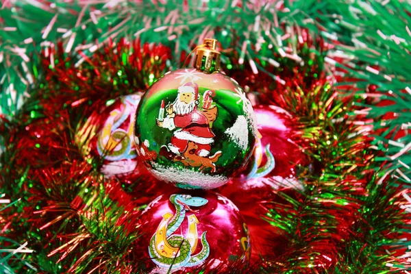 Christmas balls in tinsel — Stock Photo, Image