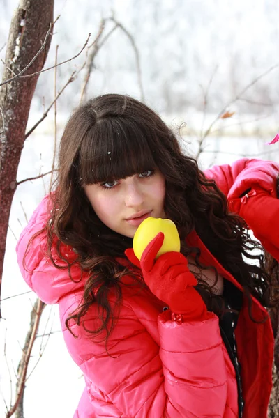 Woman holding a yellow apple — Stock Photo, Image