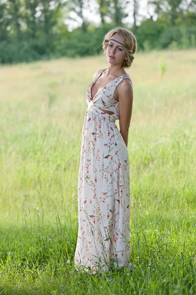 Girl in a a long dress on nature — Stock Photo, Image
