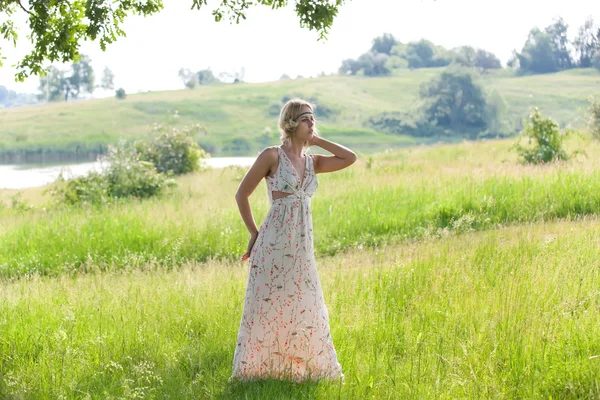 Girl in a a long dress on nature — Stock Photo, Image