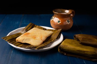 Prehispanic dish typical of Mexico and some Latin American countries. Corn dough wrapped in banana leaves. The tamales are steamed. 