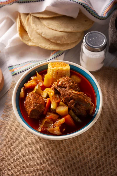 Mole de Olla. It is a balanced one pot meal, typical dish of the central region of Mexico, it is a soup-type stew based on beef and vegetables. It is consumed hot and accompanied with corn tortillas.