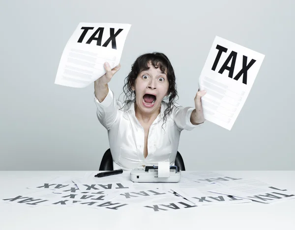 Woman frightened by taxes — Stock Photo, Image