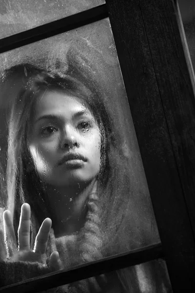 Girl behind window — Stock Photo, Image