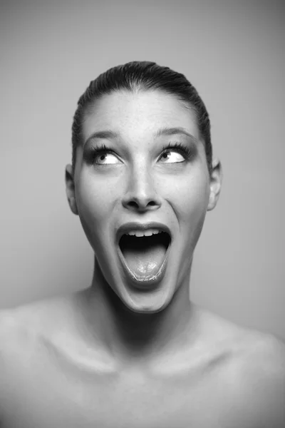 Portrait of beautiful surprised woman looking up Royalty Free Stock Images