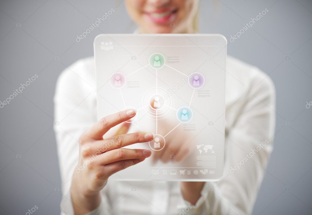 Young smiling woman using tablet computer for social networking