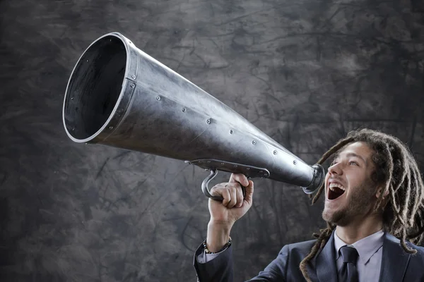 Screaming into megaphone — Stock Photo, Image