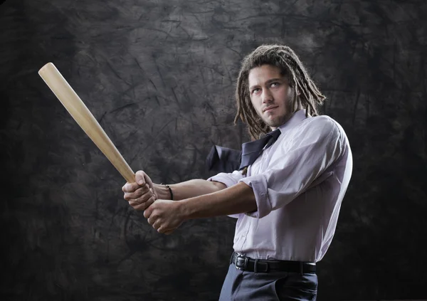 Businessman swinging baseball bat — Stock Photo, Image