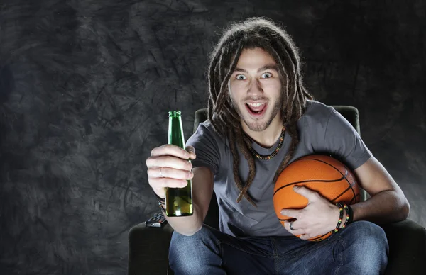 Basketballl fan watching television — Stock Photo, Image