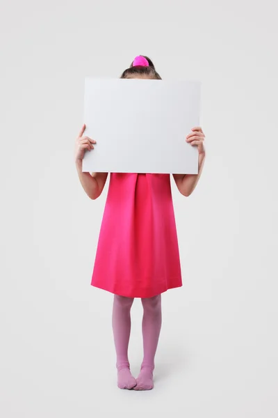 Little girl holding blank signs — Stock Photo, Image