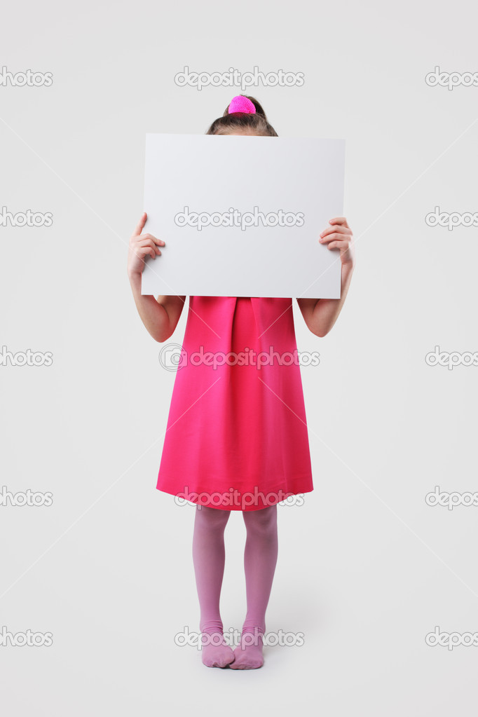 Little girl holding blank signs