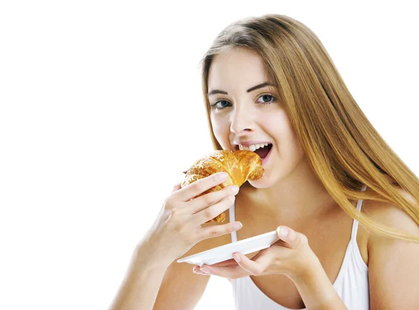 Comer un croissant — Foto de Stock