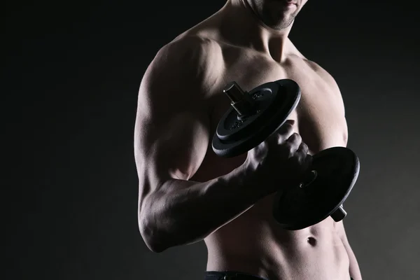 Exercising biceps with dumbbells — Stock Photo, Image