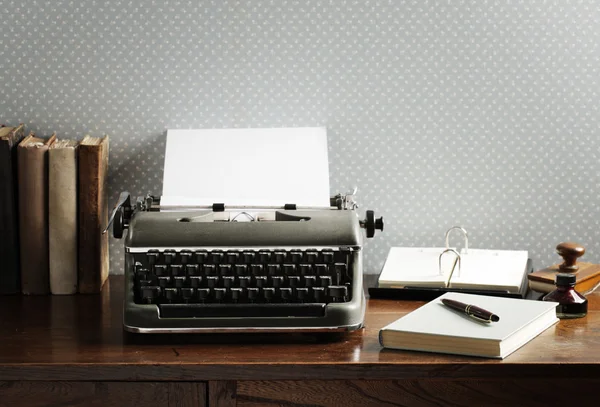 Old typewriter on a wooden desk — Stock Photo, Image