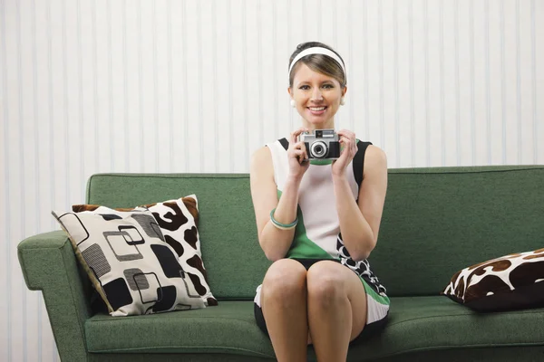 Smiling girl with vintage camera — Stock Photo, Image