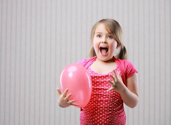 Beautiful little girl making funny face — Stock Photo, Image