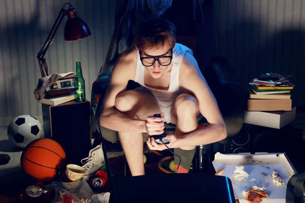 Gamer nerd playing video games on television — Stock Photo, Image