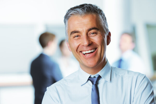 Mature businessman smiling