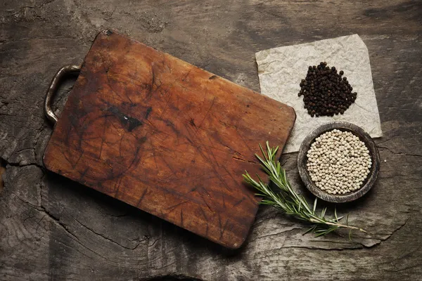 Cutting Board, rosemary and spices — Stock Photo, Image